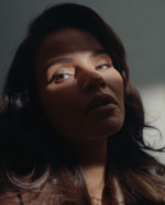 Monica Geuze in light and shadow, capturing the intimate mood of SOPHIA MAE Without Saying Much Eau de Parfum.