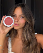 Monica Geuze holding the open SOPHIA MAE Tan Blusher compact.