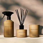 SOPHIA MAE home fragrance trio with interior perfume, perfumed reeds and candle in warm neutral tones.