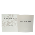 Packaging of and the Aphrodite scented candle with notes of vanilla, amber, and musk.