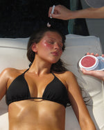 SOPHIA MAE Tan Blusher applied to a model’s cheeks in the sun.