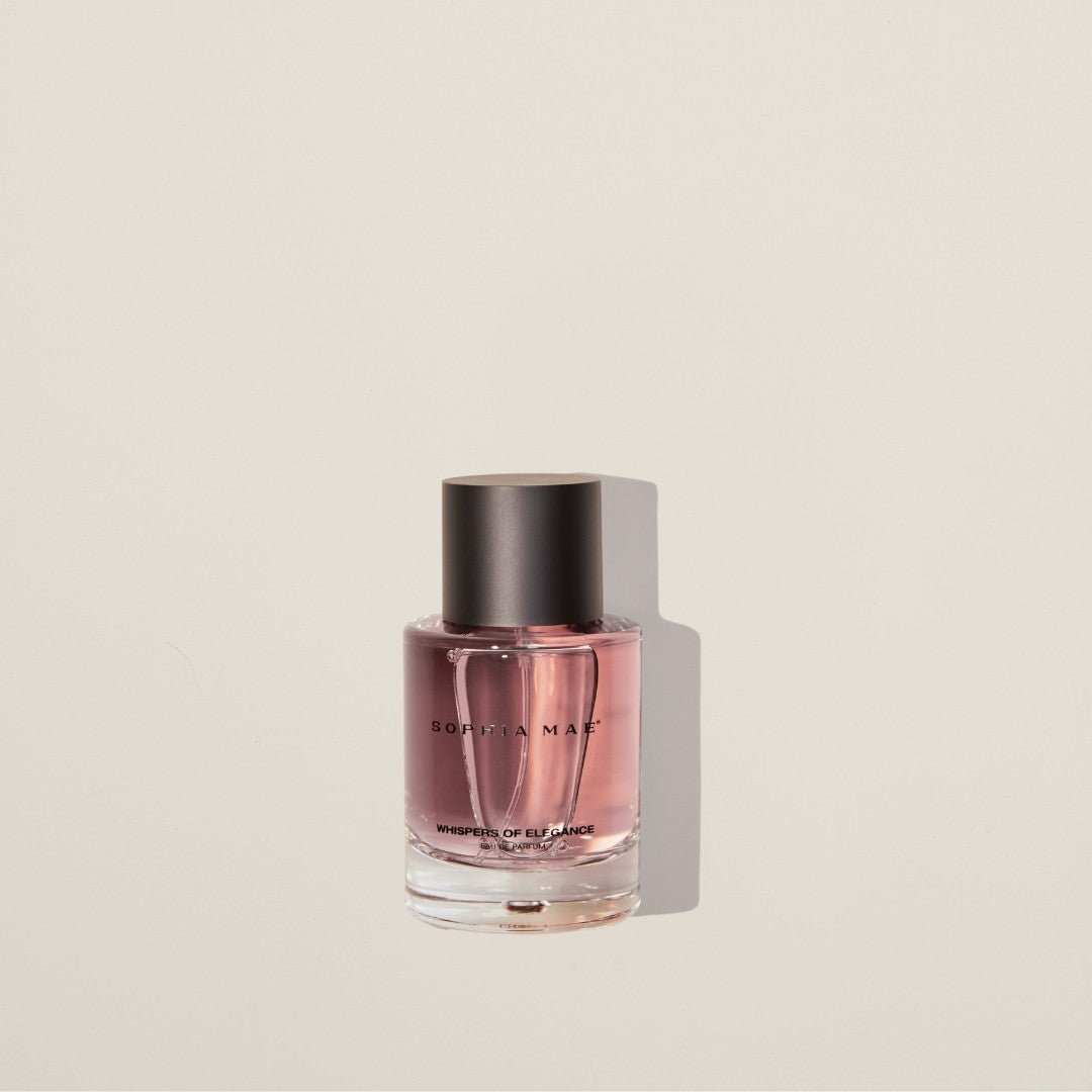 Whispers of Elegance eau de parfum – chic powdery fragrance with cedarwood, caramel, vanilla, and saffron for timeless sophistication.