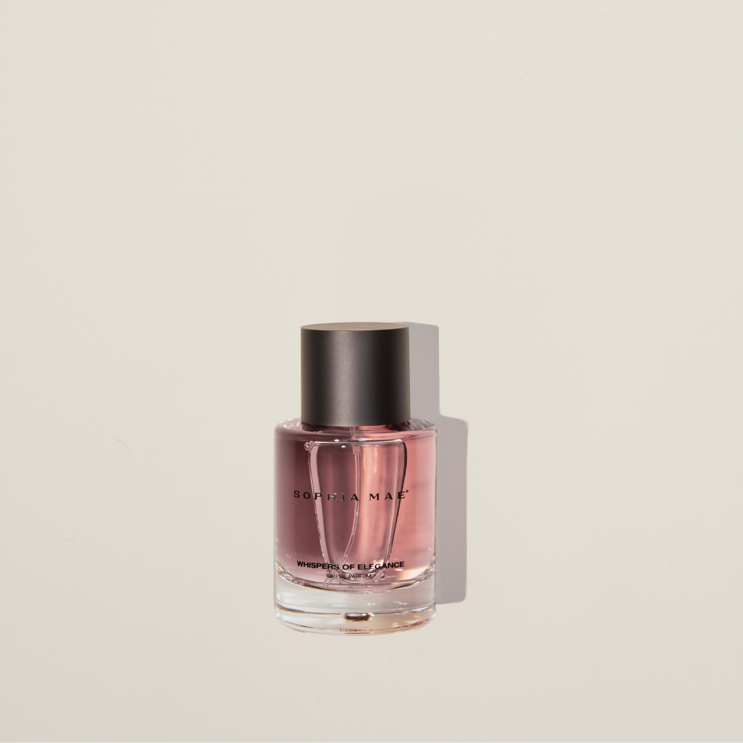 Whispers of Elegance eau de parfum – chic powdery fragrance with cedarwood, caramel, vanilla, and saffron for timeless sophistication.