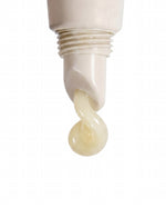 Close-up of SOPHIA MAE Liquid Lip Balm dispensing from the tube.