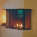 Video of a glowing fireplace with warm flames, reflecting the cosy and contrasting mood of SOPHIA MAE Arctic Spice eau de parfum.
