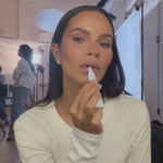 Monica Geuze applying Lip Glaze in shade Soft Pink.