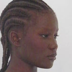 Close-up portrait highlighting a sharp, elongated wing created with Liquid Eyeliner Pitch Black.