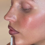 Model applying SOPHIA MAE Lip Liner in shade Deep Espresso on the lips.