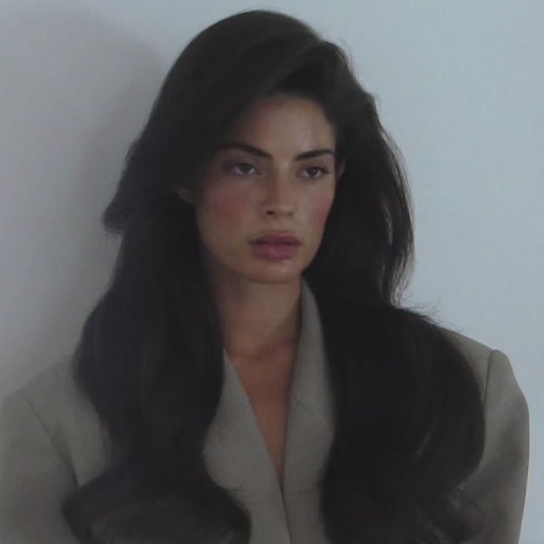 Woman showing full, voluminous hair styled with SOPHIA MAE Volumizing Dry Shampoo.