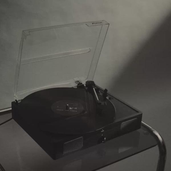 Black-and-white campaign film featuring a record player, shadowed portraits, drifting fragrance mist and Without Saying Much eau de parfum.