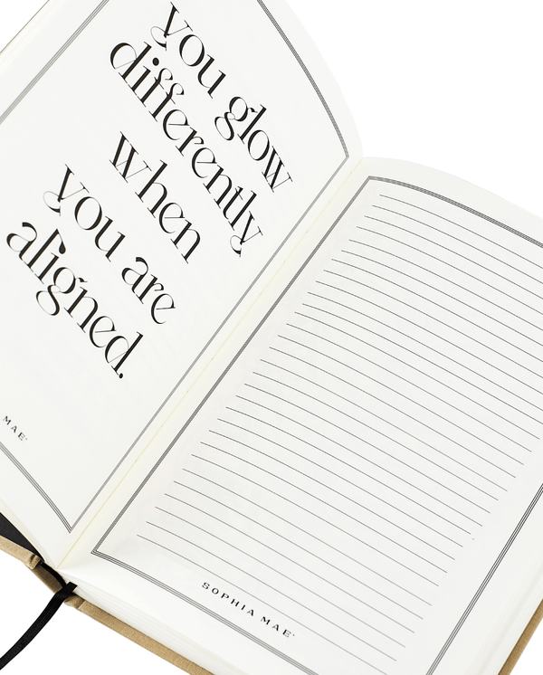 Open SOPHIA MAE notebook with an empowering quote and lined pages ready for new thoughts.